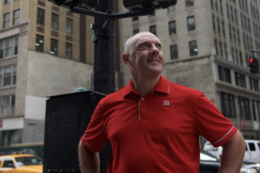 Oscar Fittipaldi looking at the building in downtown New York.
