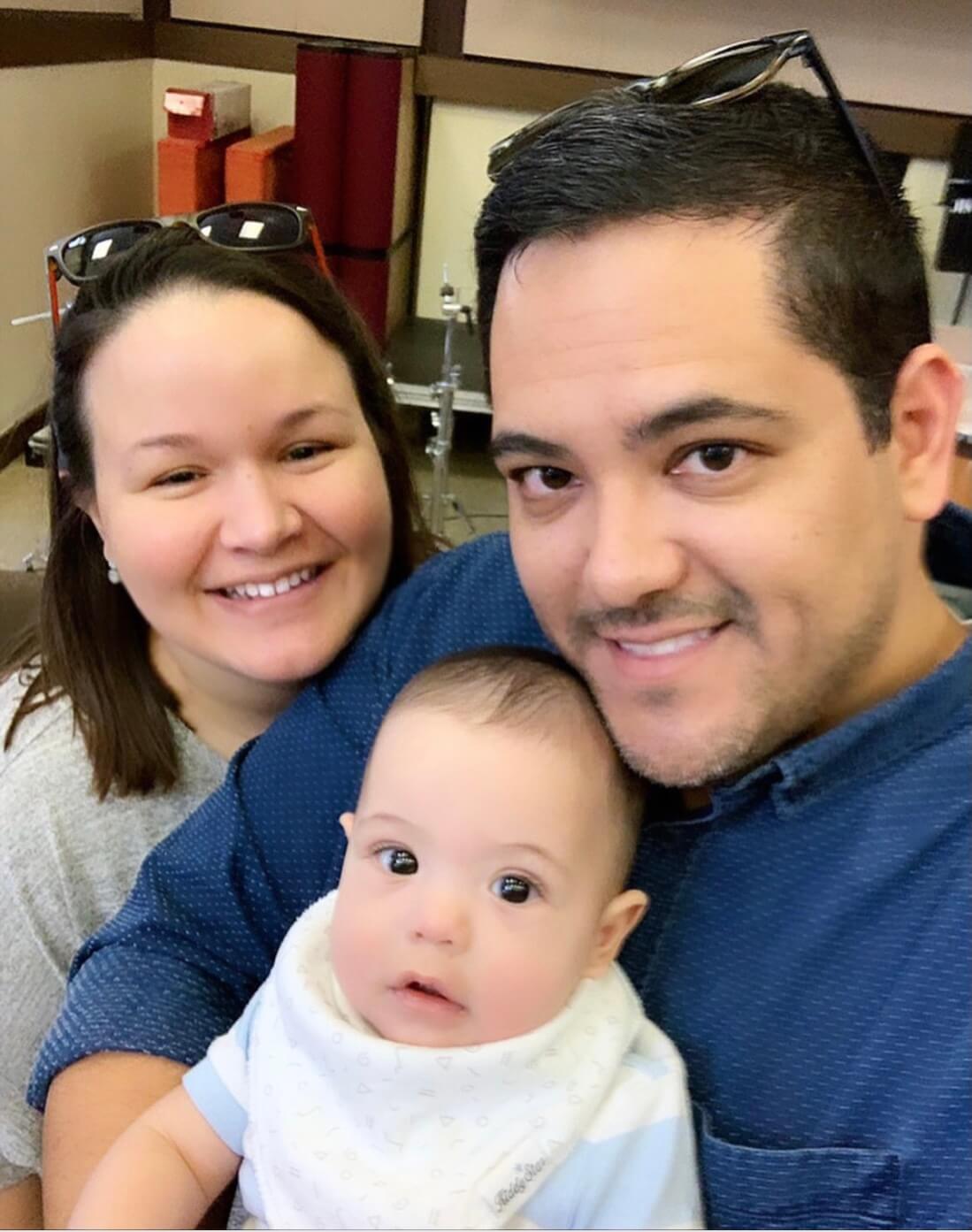 A couple with their infant child.