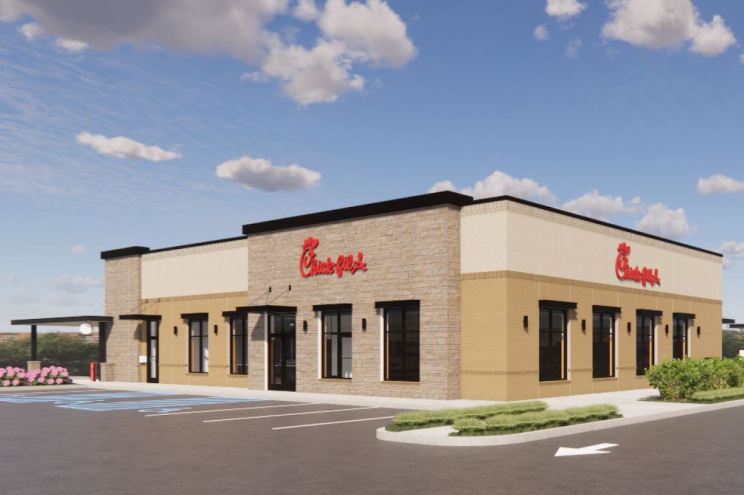 Exterior rendering of a Chick-fil-A restaurant with beige and stone facade, red logo signage, and an empty parking lot under a blue sky.