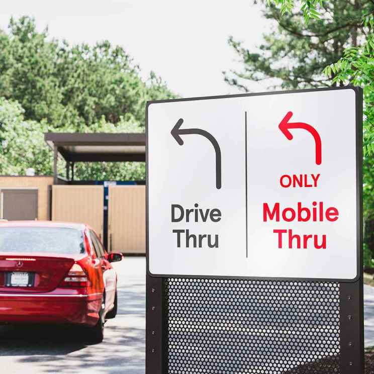 A drive-thru sign with options for "Drive Thru" and "ONLY Mobile Thru."