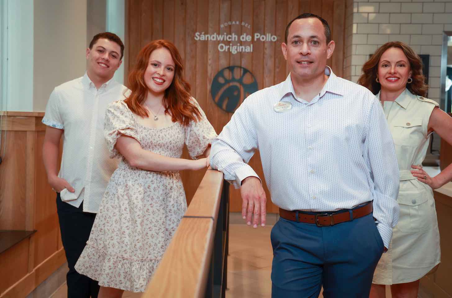 Mingo Bugos with his wife and two children, inside Chick-fil-A location.
