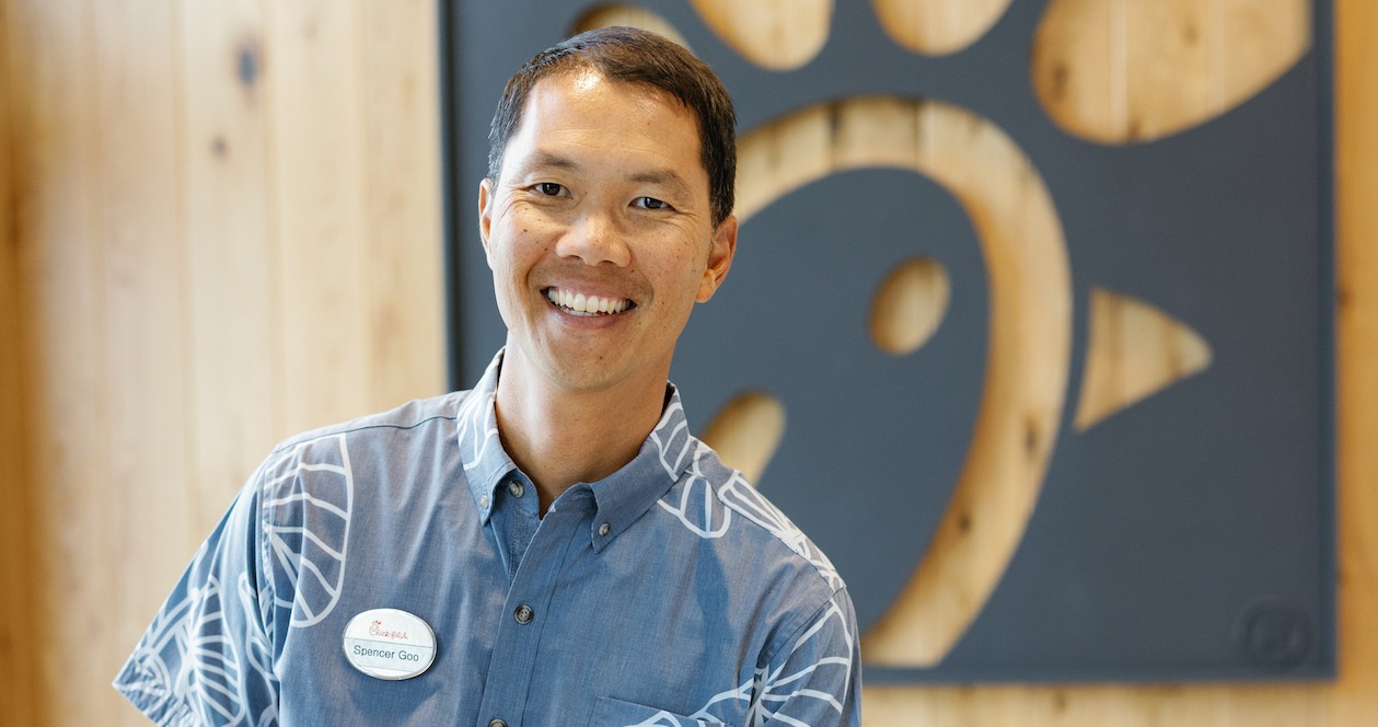 Spencer Goo smiling inside of Chick-fil-A.