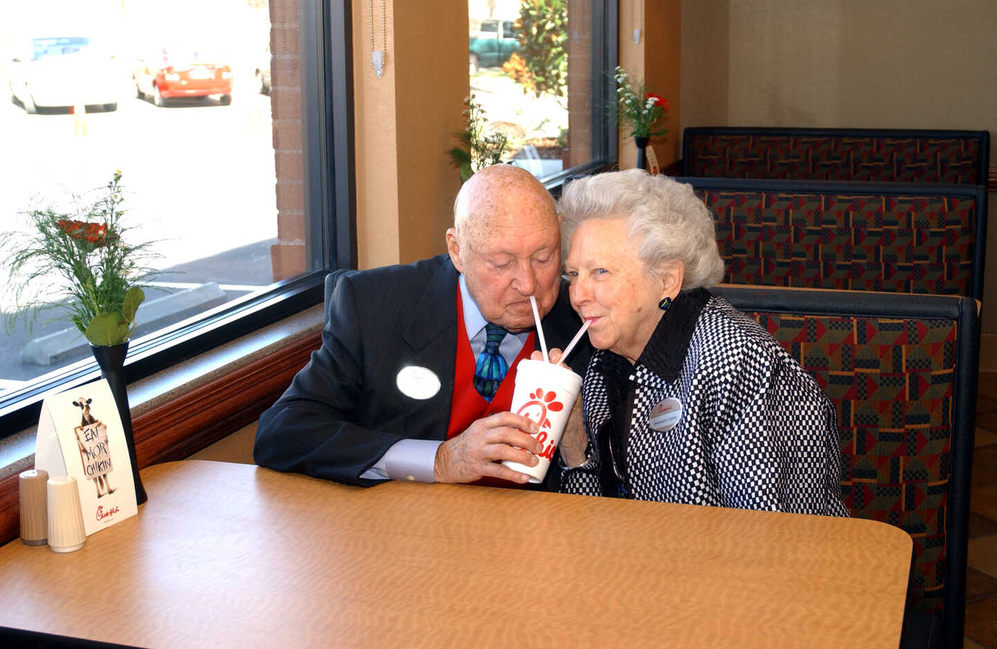 Truett Cathy and his wife Jeannette share a milkshake.