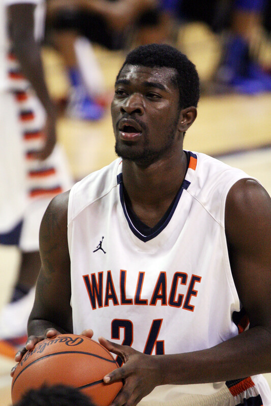 Basketball player wearing a white 'Wallace' jersey with number 24 prepares to shoot a free throw during a game.