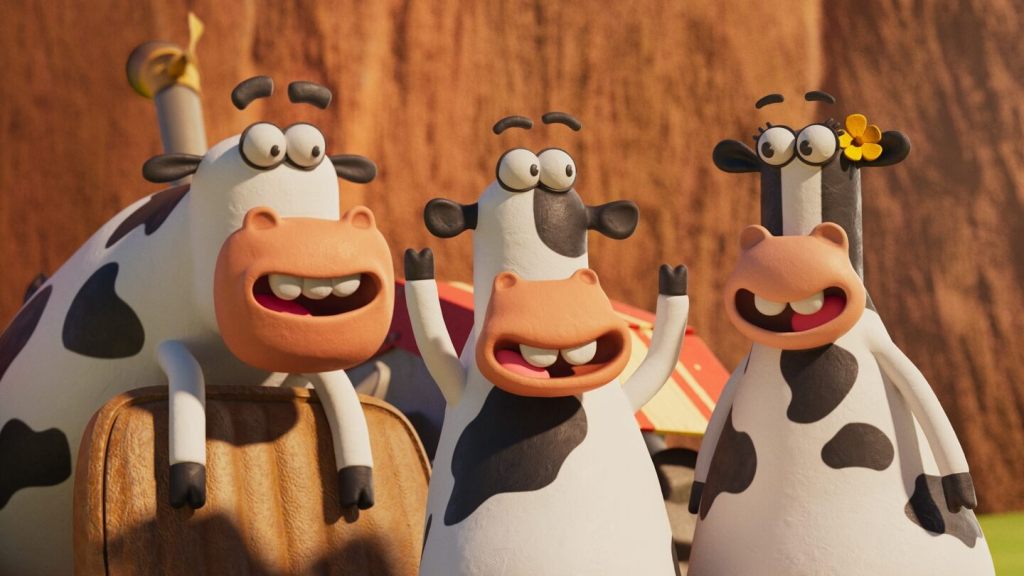 Three animated cows talking to each other.