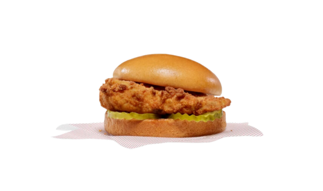 Original Chick-fil-A® Chicken Sandwichresting on a square piece of white paper that has a subtle red dotted pattern.
