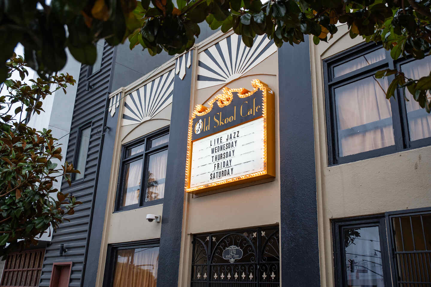 Facade of Old Skool Cafe with a vintage sign advertising live jazz.