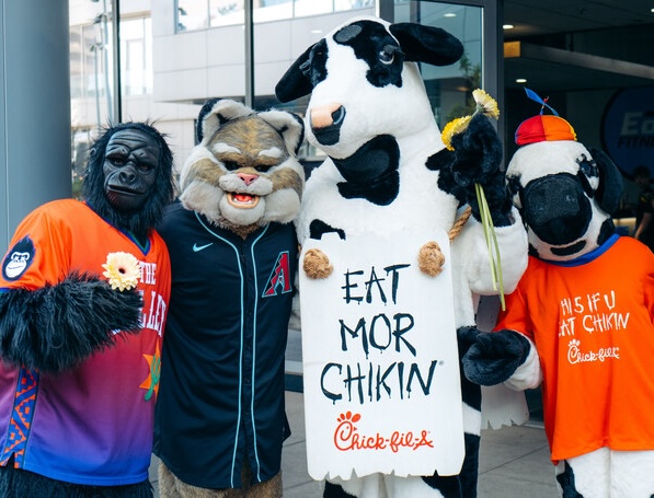 Two Chick-fil-A Cow mascots with D. Baxter the Bobcat from the Arizona Diamondbacks and Go the Gorilla from the Phoenix Suns.