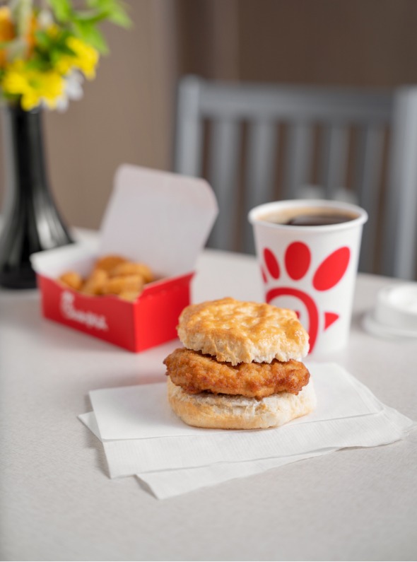 Chick-fil-A® Chicken Biscuit, Hash Browns in a branded box and coffee in a branded cup.
