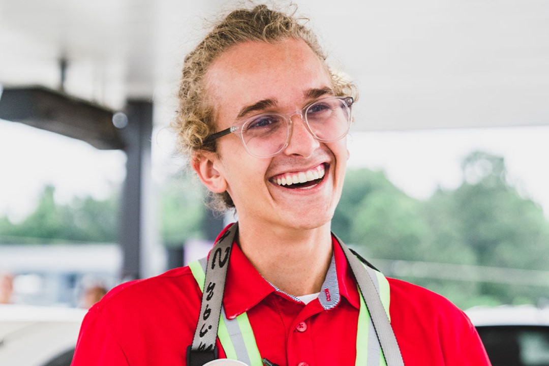 A Chick-fil-A Team Member smiling.