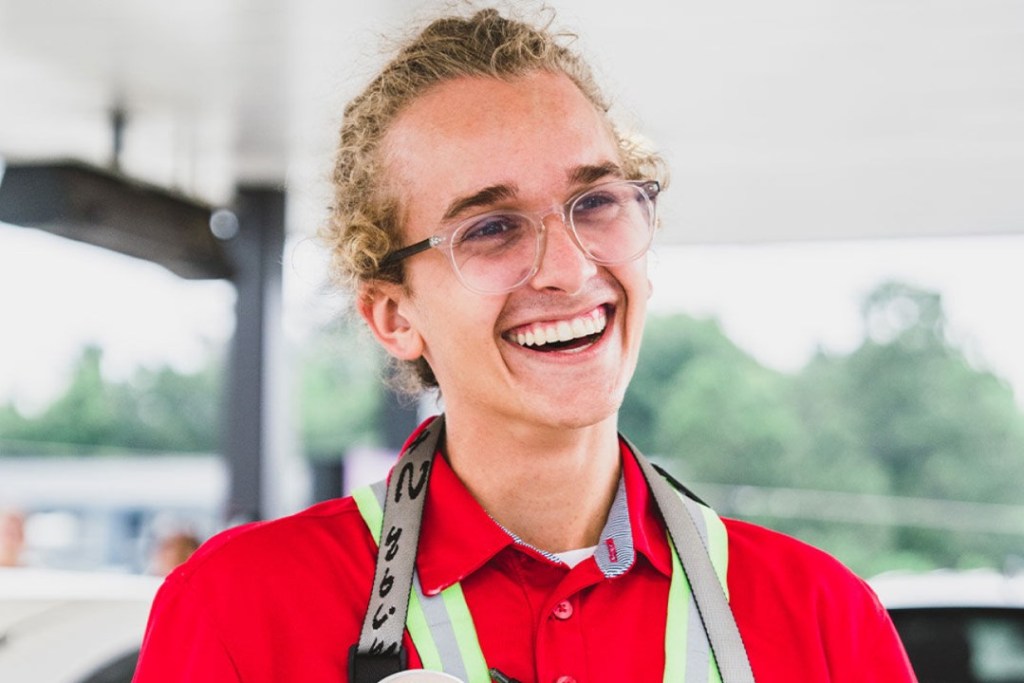 A Chick-fil-A Team Member smiling.