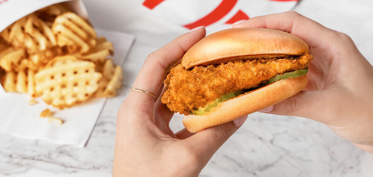 Person holding a Chick-fil-A Chicken Sandwich