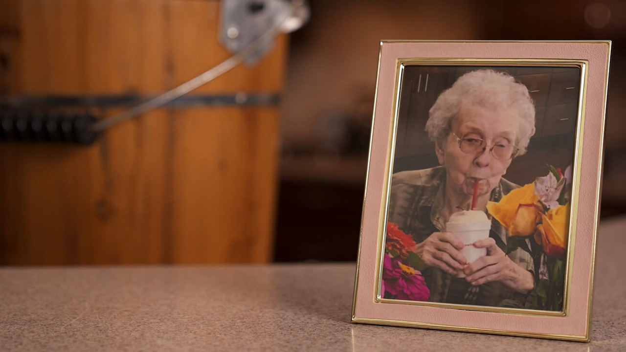 A framed picture of an older lady