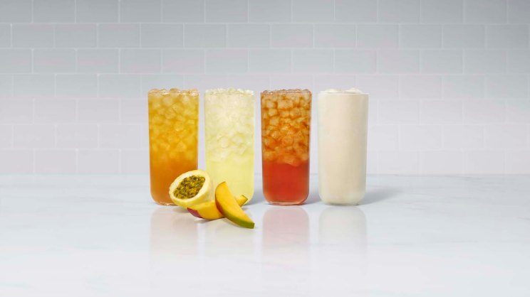 A glass of Mango Passion Sunjoy®, Mango Passion Lemonade, Mango Passion Tea and Mango Passion Frosted Lemonade, with fresh sliced mango and passion fruit.