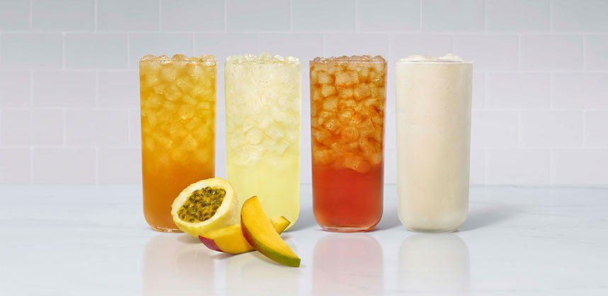A glass of Mango Passion Sunjoy®, Mango Passion Lemonade, Mango Passion Tea and Mango Passion Frosted Lemonade, with fresh sliced mango and passion fruit.