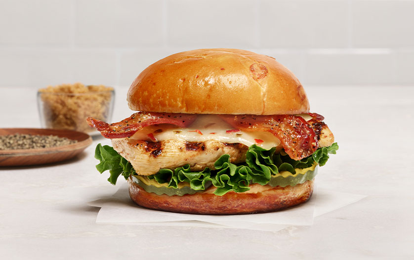 Maple Pepper Bacon Sandwich next to brown sugar and spices.