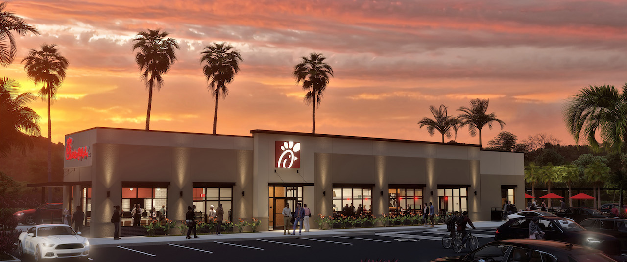 Chick-fil-A location at sunset with palm trees and a parking lot in the foreground.