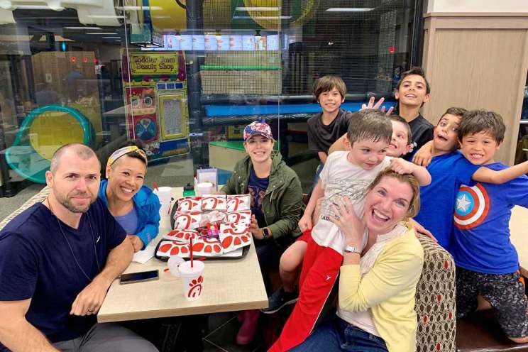 A group of parents and kids in a Chick-fil-A indoor playground