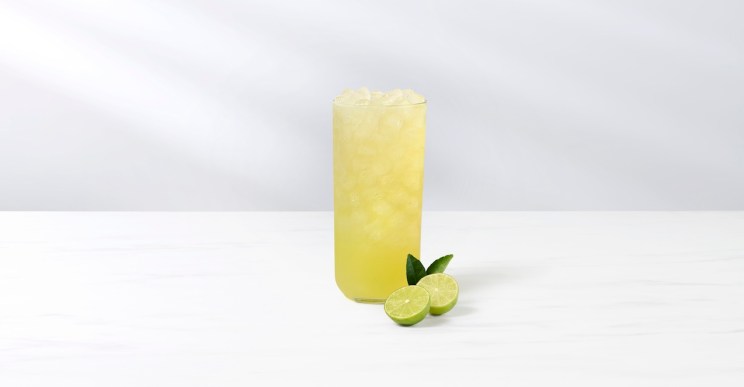 Key Lime Lemonade in a glass with a sliced fresh key lime