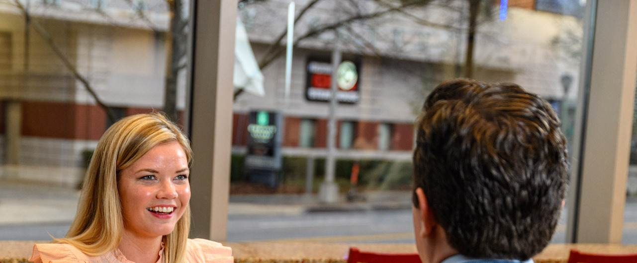 Two team members talking.