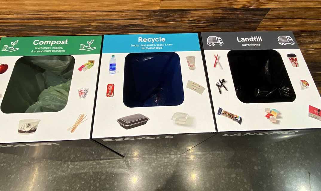 Three waste bins labeled "Compost," "Recycle," and "Landfill."
