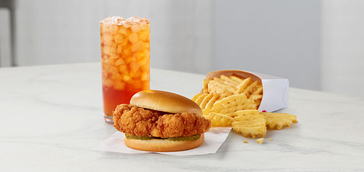 Chick-fil-A Cauliflower Sandwich with waffle fries and and Iced Tea.