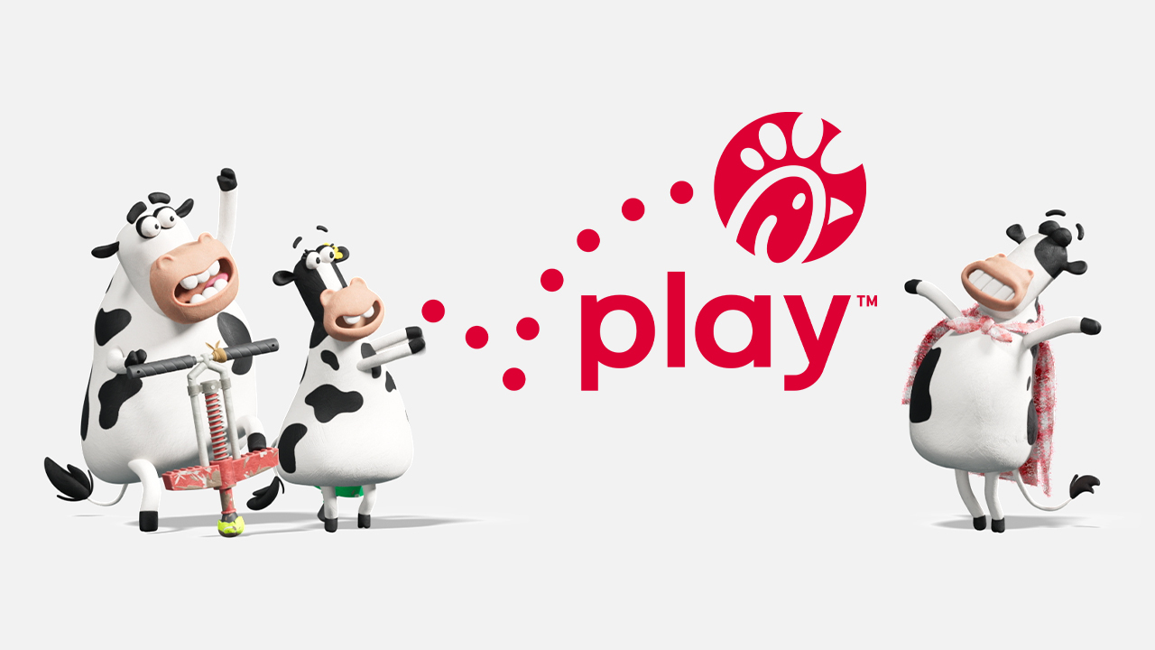 Three cartoon cows playfully interacting with a red logo and the word "play" in red text.