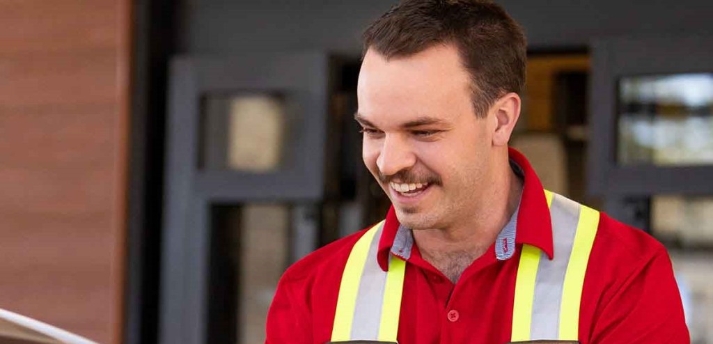 A Team Member standing outside a Chick-fil-A Restaurant