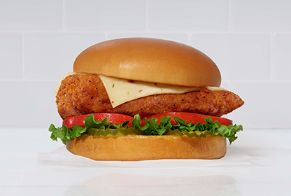 Chick-fil-A Spicy Chicken sandwich with gray tile background