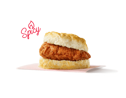 Spicy chicken fillet on a biscuit with the word Spicy in the background