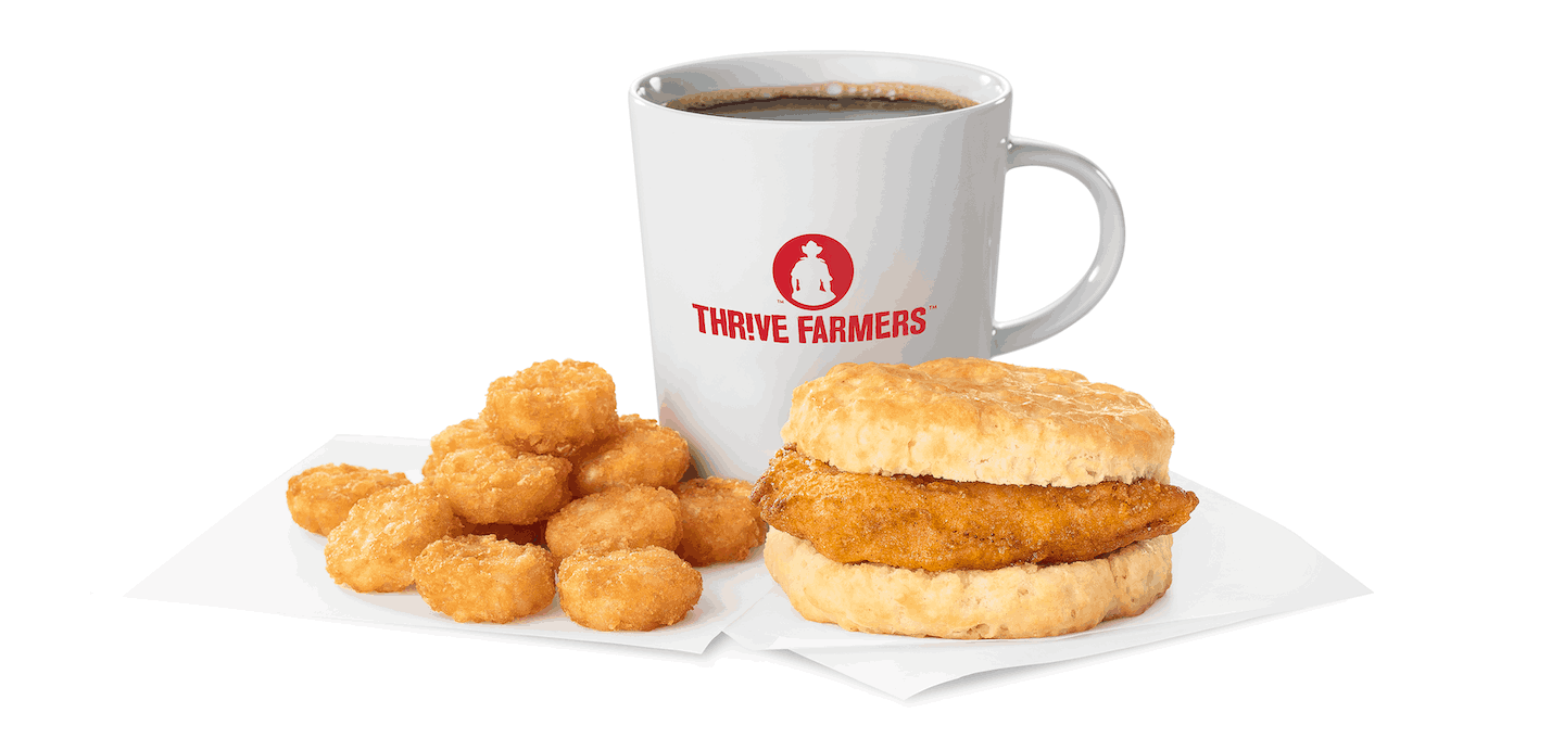 Chick-fil-A® Chicken Biscuit, Hash Browns and a cup of coffee in a Thrive Farmers branded mug.