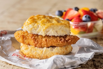 Chick-fil-A® Chicken Biscuit and a cup of mixed fruit.
