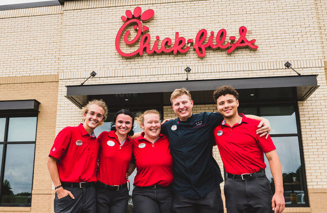 Five Team Members standing together outside of a Chick-fil-A Restaurant