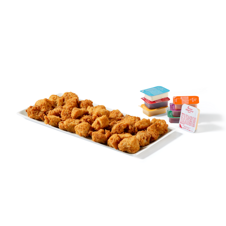 30-count Chick-fil-A® Nuggets on a platter with stacked assorted sauces