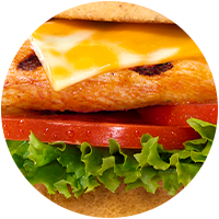 closeup view of Grilled Spicy Deluxe sandwich focused on toppings
