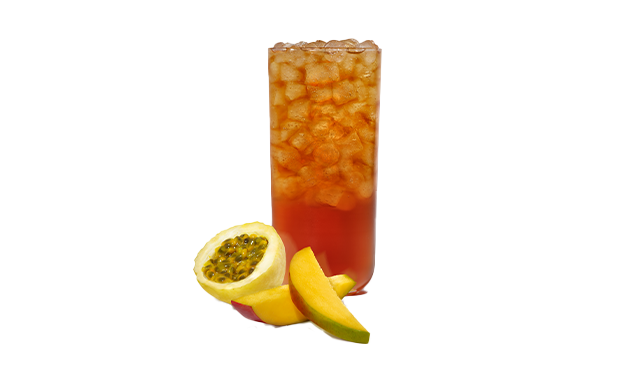 A glass of Mango Passion Tea with fresh sliced mango and passion fruit.