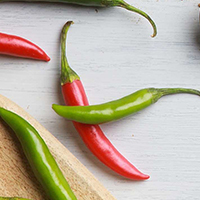 Closeup of red and green spicy peppers.