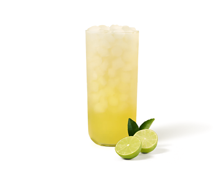 Key Lime Lemonade in a glass with a sliced fresh key lime