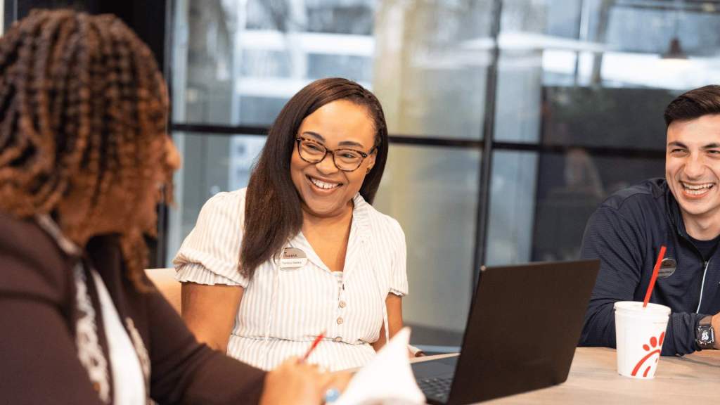 Co-workers smiling and talking