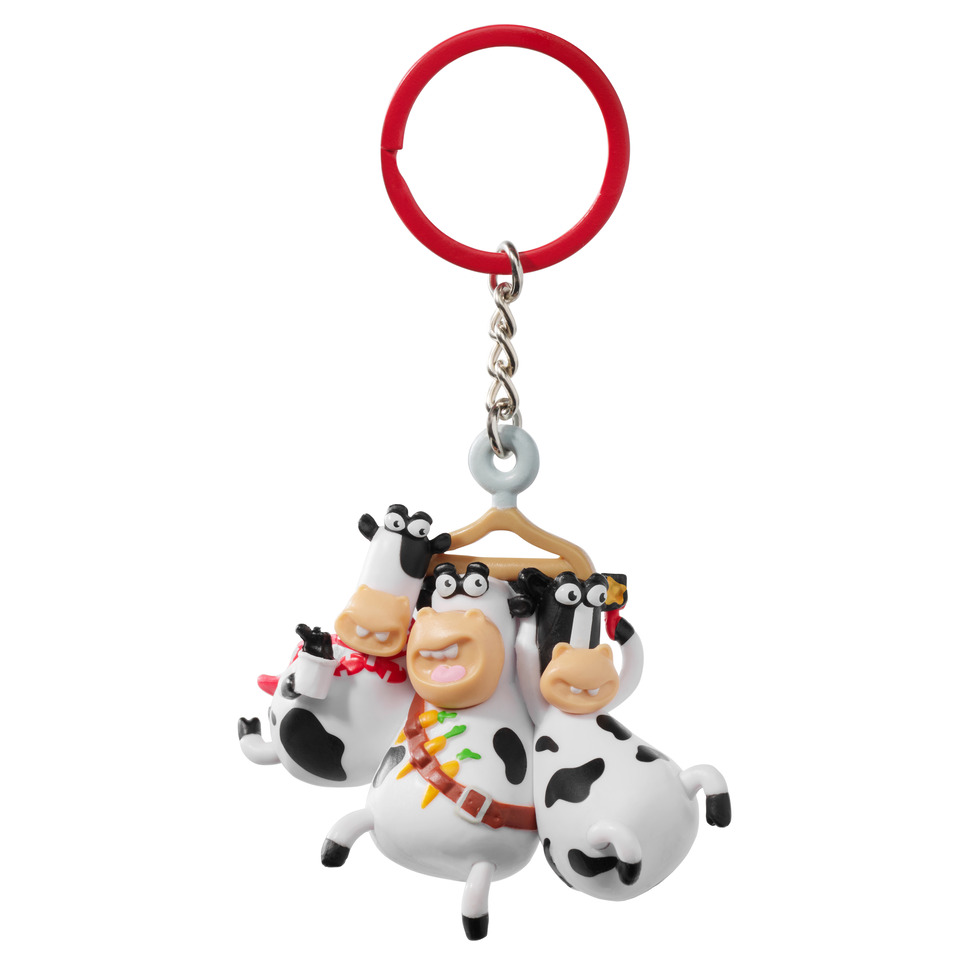 Keychain with three cartoon cow figurines hanging from a hanger.