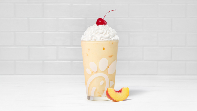 Peach Frosted Lemonade with a sliced peach.