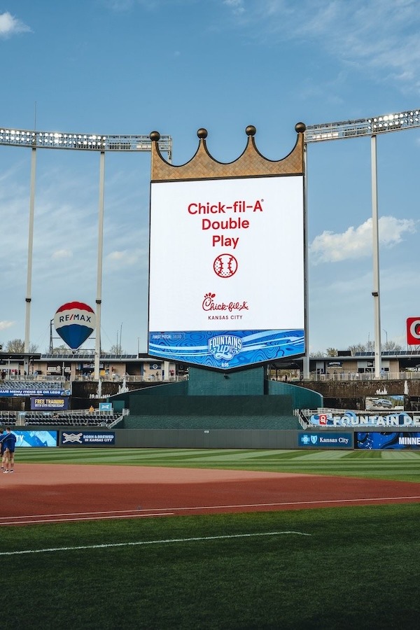 Kauffman Stadium scoreboard displays “Chick-fil-A Double Play” promotion in Kansas City.