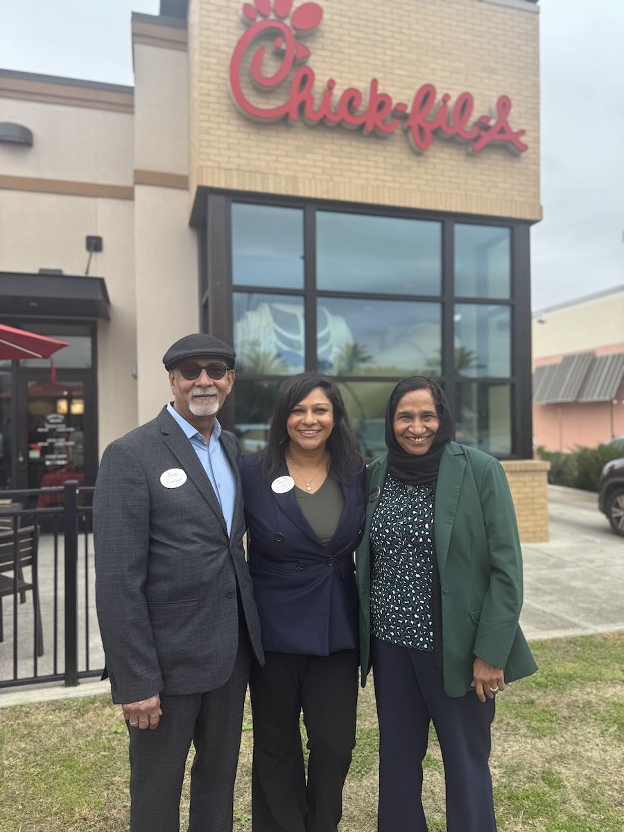 Ummara Sajid posing with her parents outside at Chick-fil-A Nassau Bay.