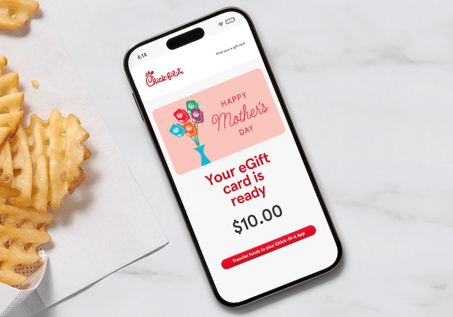 Smartphone displaying a Chick-fil-A Mother's Day eGift card notification next to waffle-cut fries.