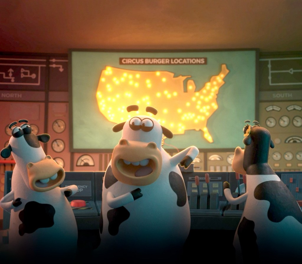 Three cartoon cows in a control room with a map of the United States showing multiple glowing locations.