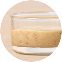 Dijon mustard in a glass dish.