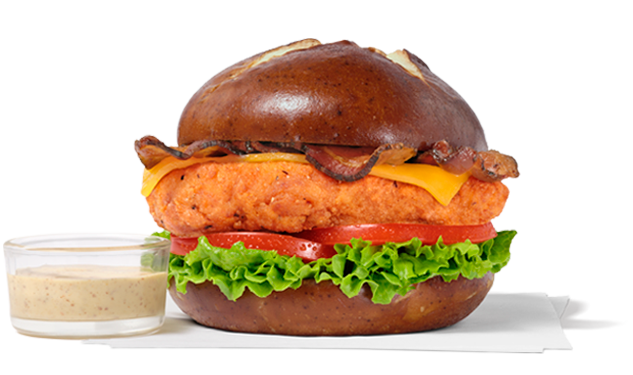 Spicy Pretzel Cheddar Club with a small glass cup of dijon mustard.