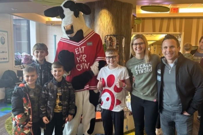 Matt, Aidden and a Group with the Chick-fil-A cow mascot.
