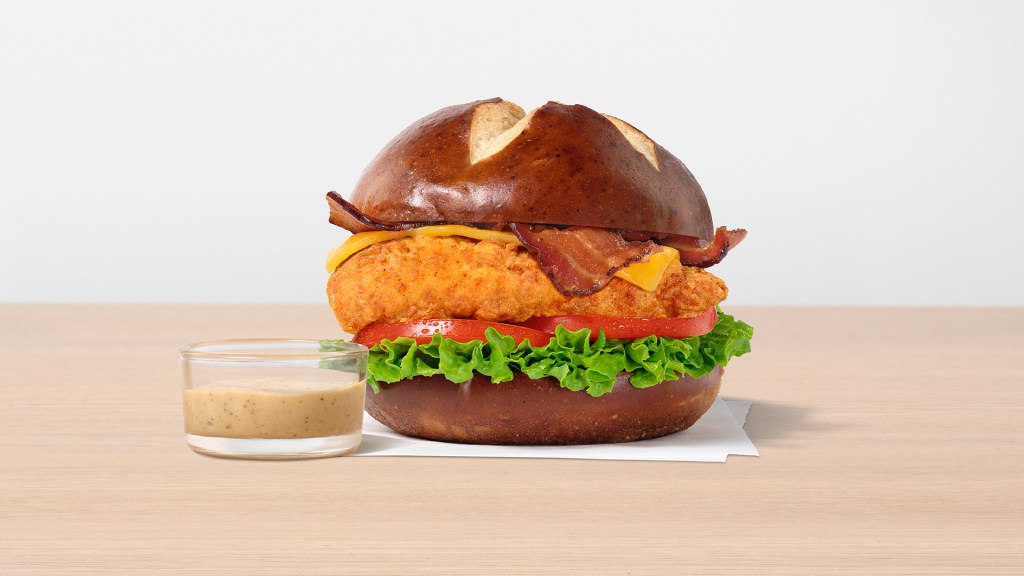 Original Pretzel Cheddar Club with a small glass cup of dijon mustard.