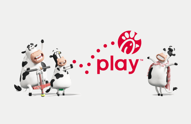 Three animated cows with a pogo stick and a blanket, alongside the word "play" with a red logo.
